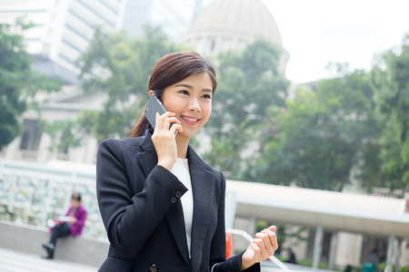 Businesswoman chat on cellphoneの写真素材
