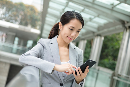 Business woman use of mobile phoneの写真素材