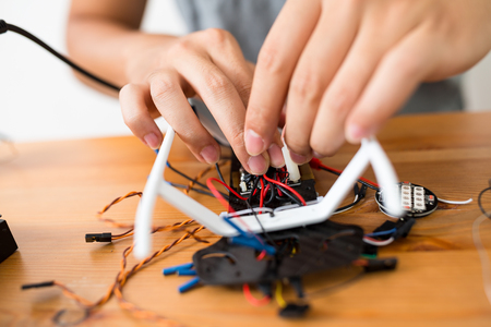 Connecting the wire of flying droneの写真素材