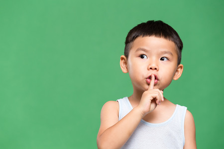 Little boy making a hush poseの写真素材