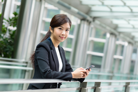 Businesswoman use of mobile phoneの写真素材