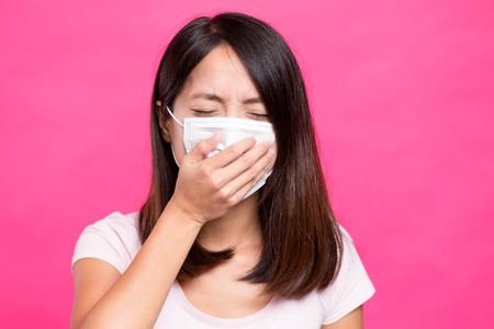 Woman cough and cover by handの写真素材