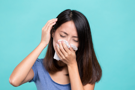 Woman feeling unwell and headacheの写真素材