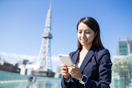 Businesswoman using mobile phoneの写真素材