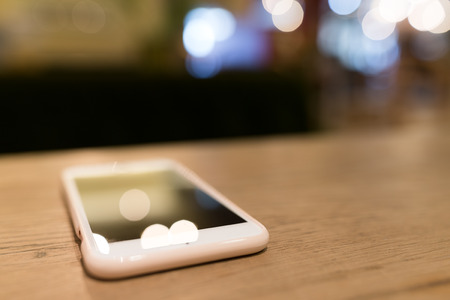 Mobile phone on tableの写真素材