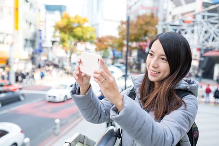 Woman capture photo by cellphoneの写真素材