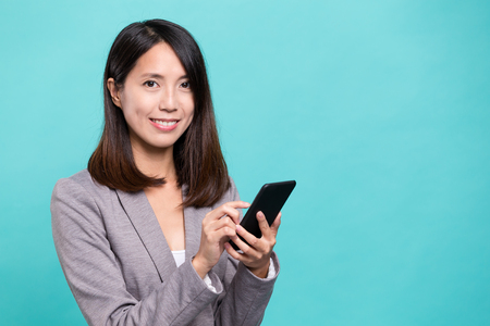 Asian businesswoman using cellphoneの写真素材