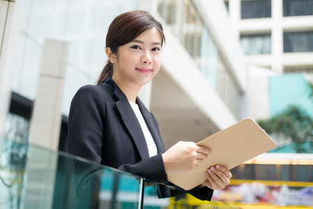 Businesswoman hold with clipboardの写真素材