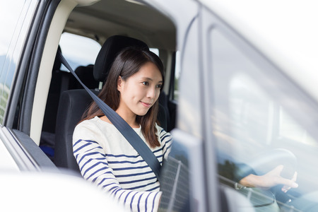 Asian Woman driving a carの写真素材