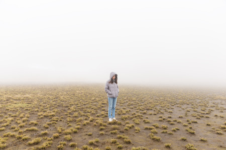 Woman in marsh at winterの写真素材