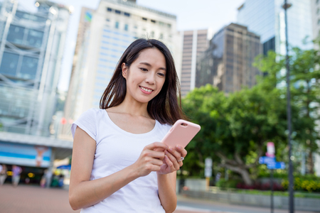 Woman using mobile phoneの写真素材