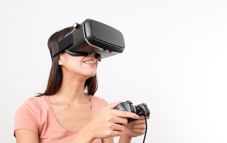 Woman play with console and VR device