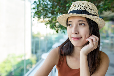 Woman looking out of the windowの写真素材