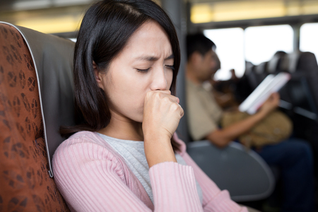 Woman cough inside the boatの写真素材