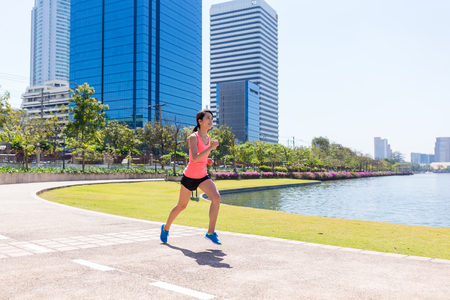 Woman running at cityの写真素材