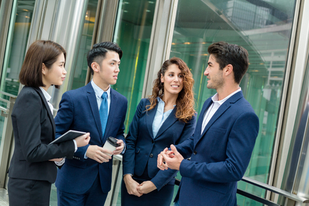 Business team discuss outside officeの写真素材