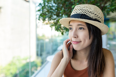 Woman looking out of windowの写真素材