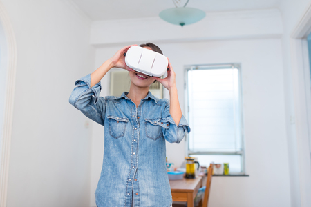 Woman wearing VR deviceの写真素材