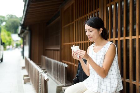 Woman enjoy snack in Japanese traditional houseの写真素材