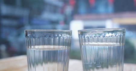 Two glass of water glass with city background の写真素材