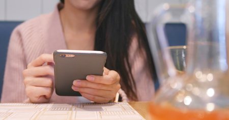 Using smart phone at the street の写真素材