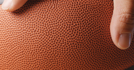 Man hand holding basketball の写真素材