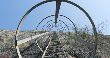 Safety ladder up to the top of an industrial 