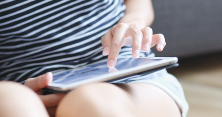 Woman use of digital tablet computer の写真素材