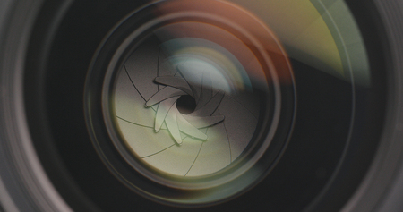 Camera lens adjusting aperture and zoom in and outの写真素材