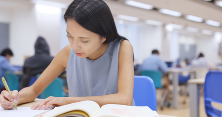 Woman study at library の写真素材