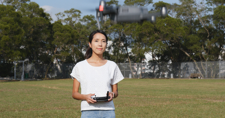 Woman control fly drone 