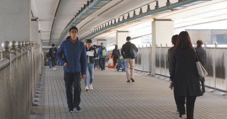 Hung Hom, Hong Kong 16 January 2018:- People walking in the pedestrian bridge のeditorial素材