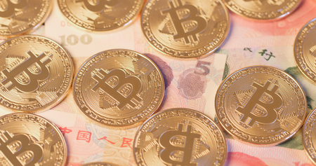 Bitcoin over chinese banknoteの写真素材