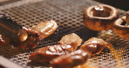Barbecue with chicken wing and mushroom の写真素材