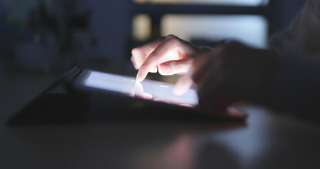 Touching on tablet computer の写真素材