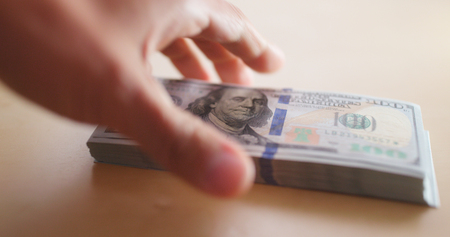 Taking Stack of USD  の写真素材