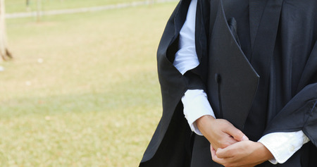 Female woman holding graduation cap の写真素材