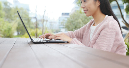 Woman working on laptop computer の写真素材