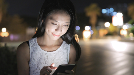 Woman use of mobile phone in Hong Kong の写真素材