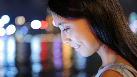 Close up of woman looking at the screenの写真素材