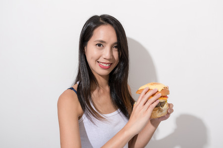 Woman enjoy burgerの写真素材