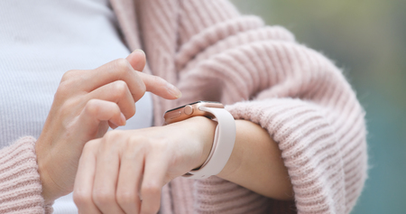 Woman using smart watch の写真素材