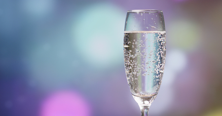 Sparkling Champagne over holiday background の写真素材