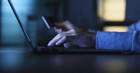 Online shopping with credit card and laptop computer の写真素材