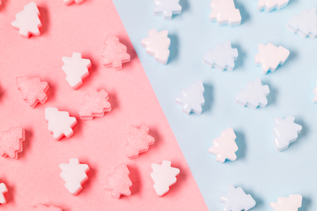 Christmas tree candy on pink and blueの写真素材