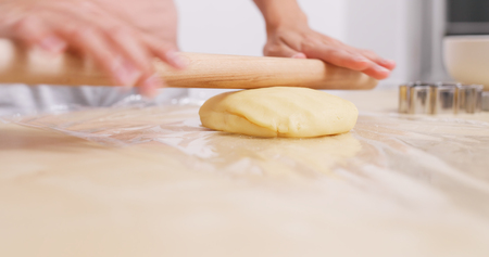 Rolling on dough の写真素材