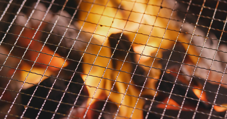 Charcoal fire with metal net の写真素材