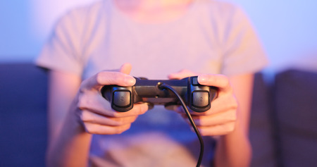 Woman play the game with joystick