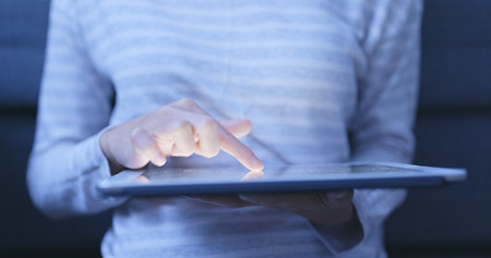 Woman shopping on tablet computerの写真素材
