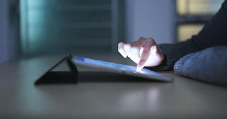 Use of tablet computer at homeの写真素材